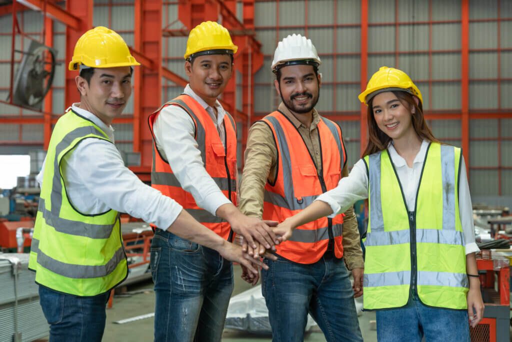 Workers wearing industrial safety equiment